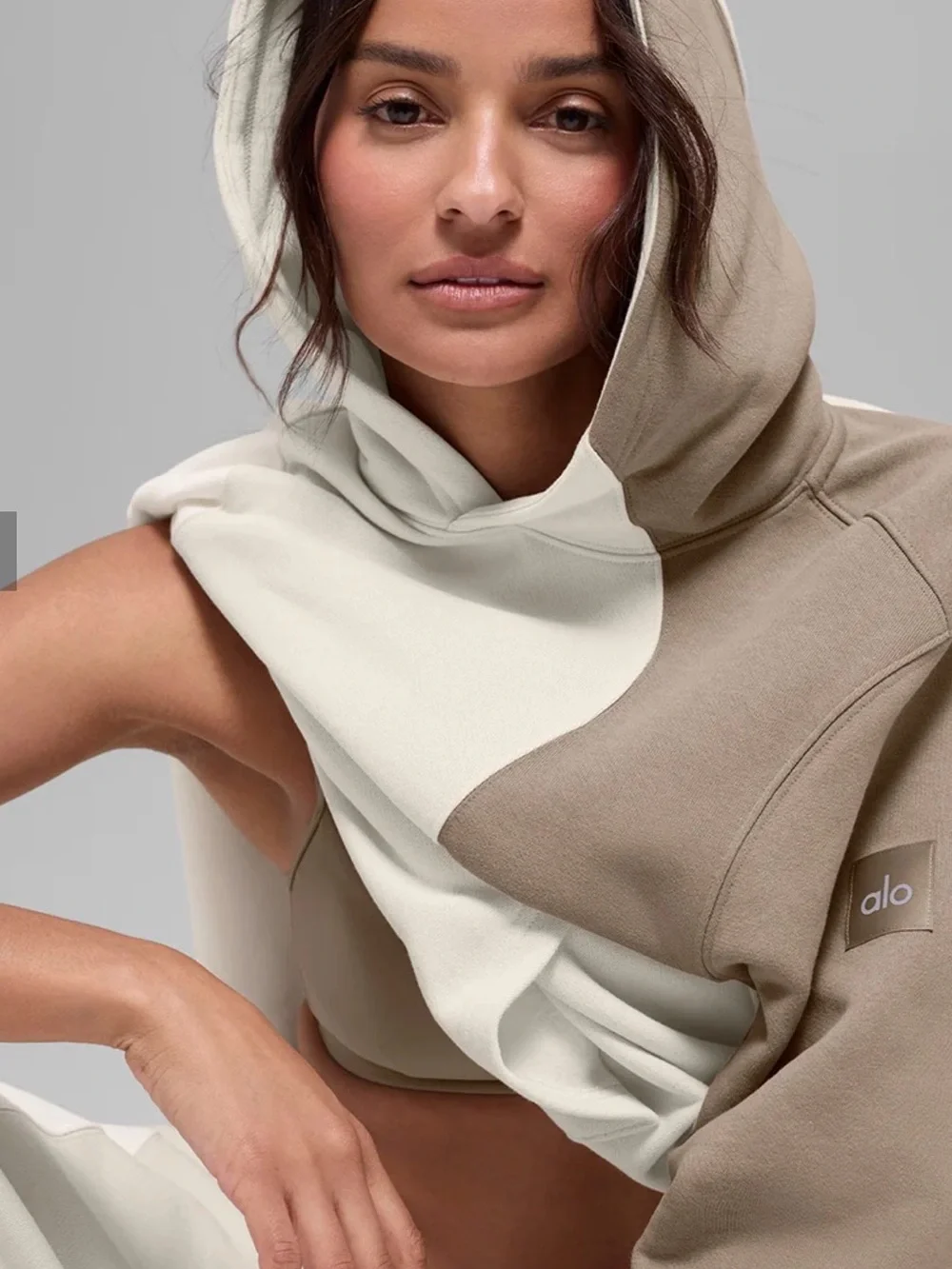 ALO Yoga Cream and Tan Colorblock Hoodie also have the tan pants to match